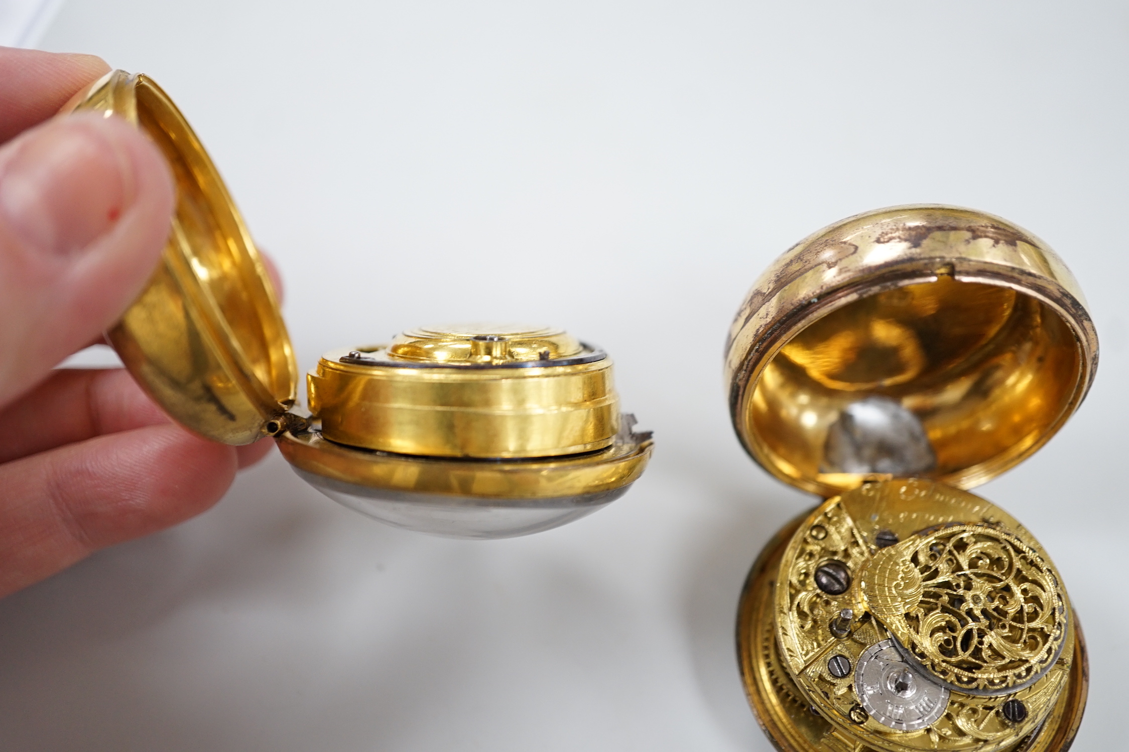 An 18th century gilt metal pair cased keywind verge pocket watch, by Frank Upjohn of London (a.f.) and a similar pocket watch by J. Edmond of Liverpool.